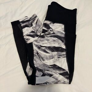 Athleta leggings sz large 
Black with white and grey pattern, sheer parts on leg